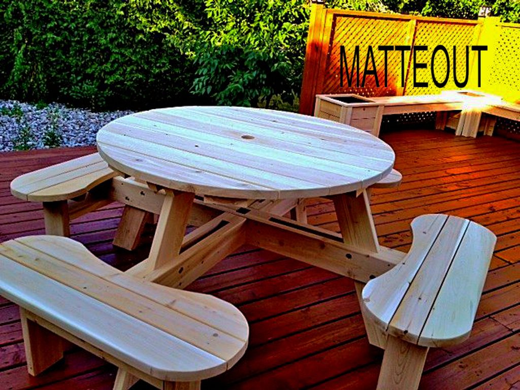 Matteout handcrafted round cedar picnic table featuring a commercial grade walk-in design on a residential wooden backyard deck.