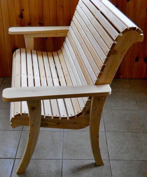 Side view profile of a handcrafted 2-seater cedar roll-back glider bench with a contoured ergonomic seat design.